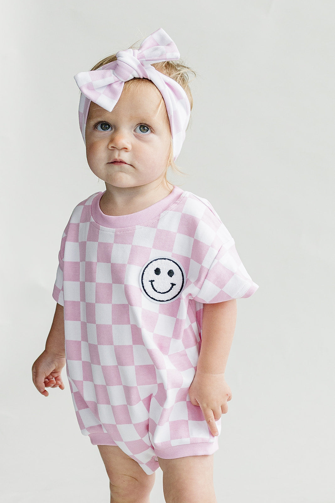Short Sleeve Bubble Romper | Checkered Smiley Pink — Star Product of the Day at Jeans.com
