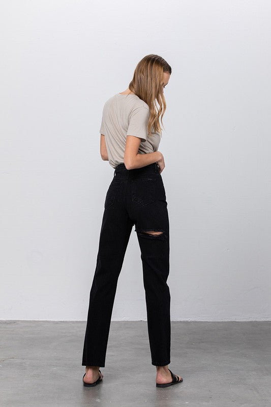 High Waist Destroyed Mom Jeans in black non-stretch denim with ripped knee; size 3, waist 28, inseam 29.