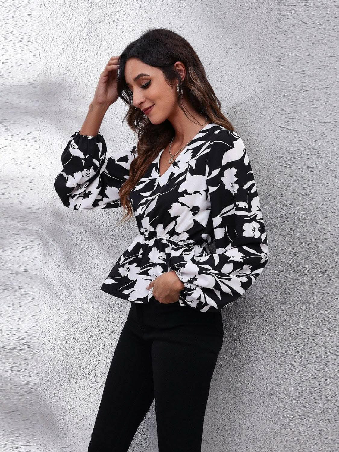 Trendsi Floral peplum blouse with v-neck