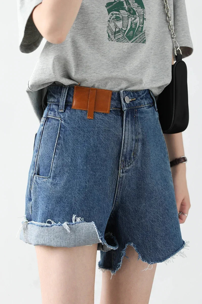 Loran High-Rise Irregular-Cut Denim Shorts in Blue