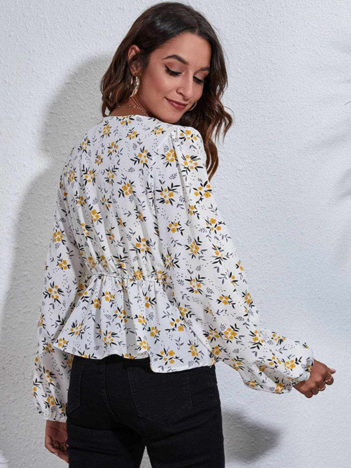 Trendsi Floral peplum blouse with v-neck
