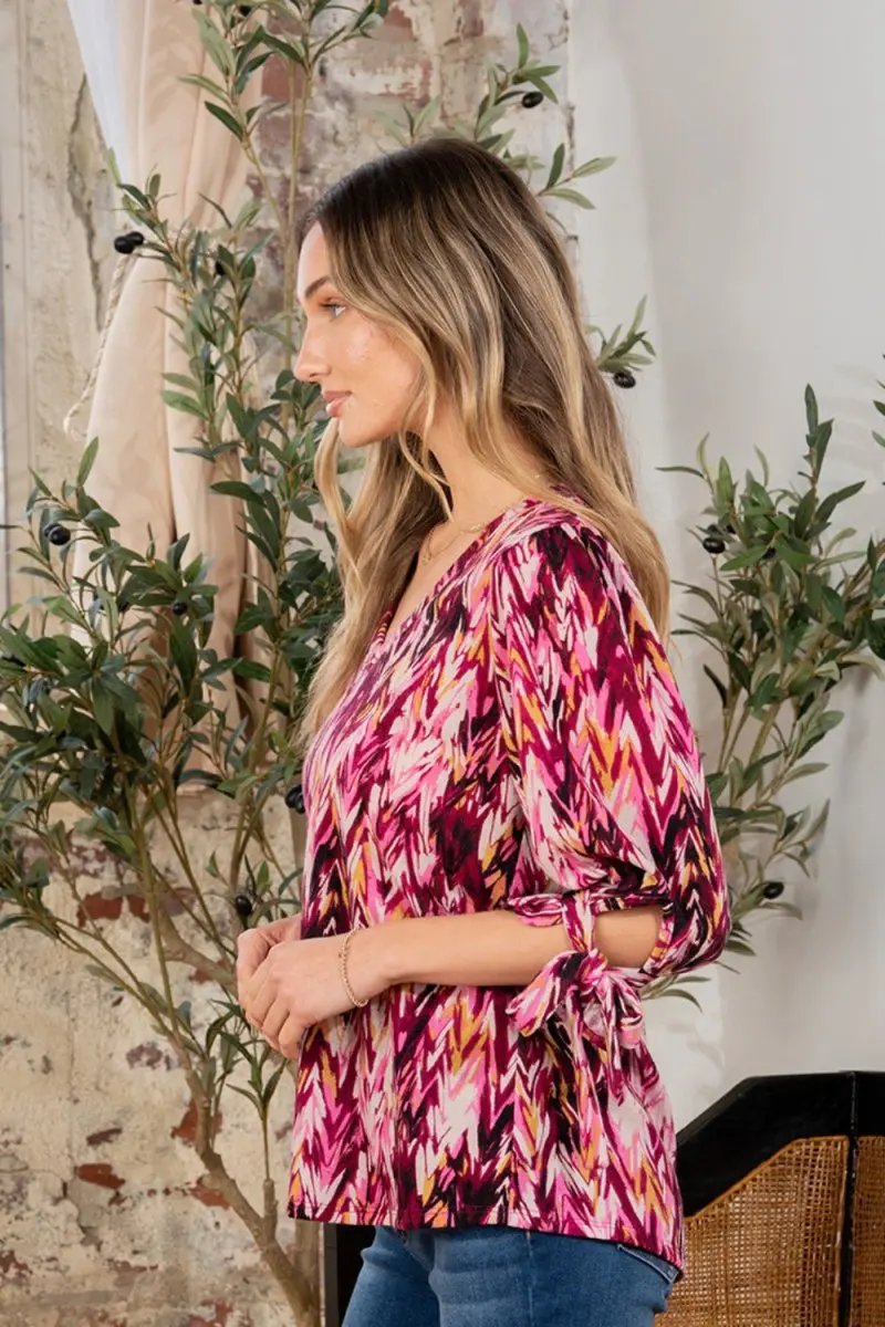 Trendsi Printed V-Neck Blouse Women's Casual Top with Sleeve Knot Detail