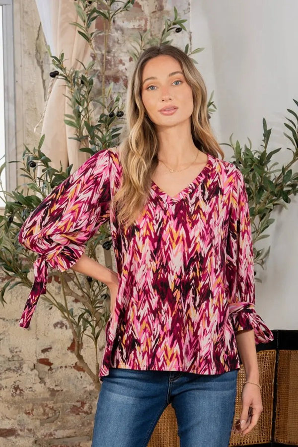 Trendsi Printed V-Neck Blouse Women's Casual Top with Sleeve Knot Detail