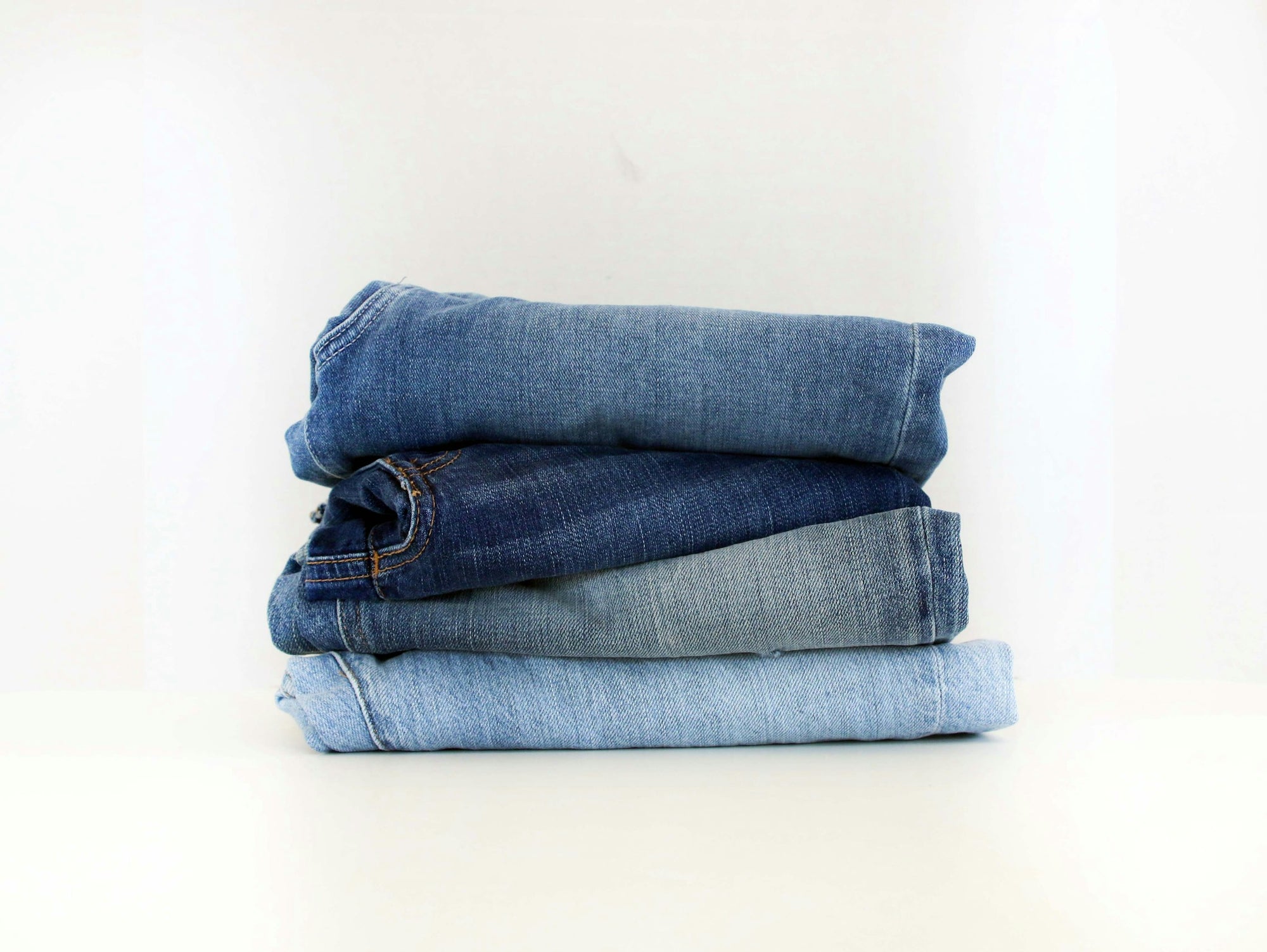 Folded jeans in a stack